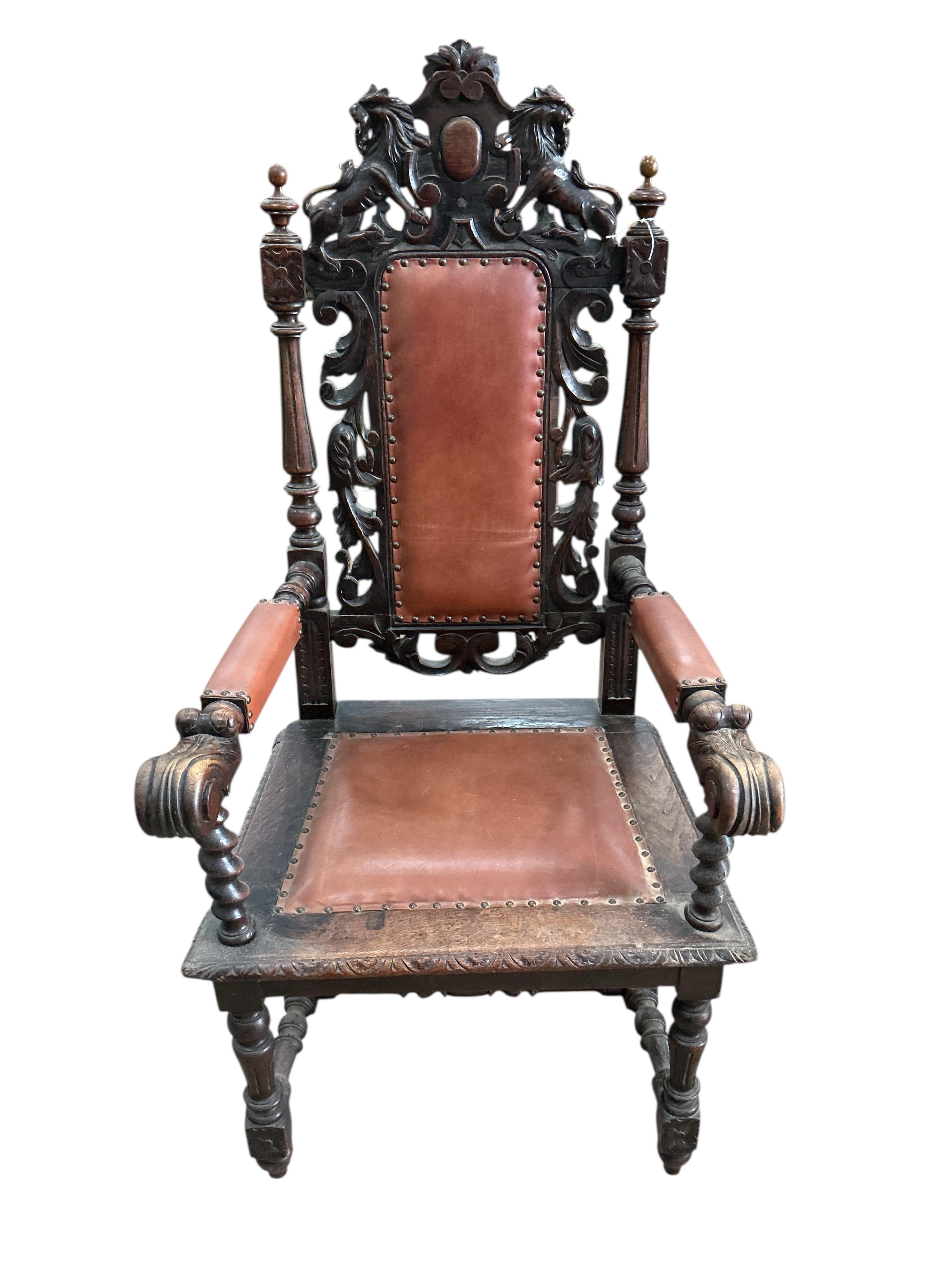 A late Victorian carved oak elbow chair, width 64cm, depth 62cm, height 136cm